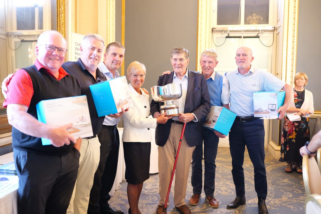 Winners of the 41st Annual CWRF Charity Golf Day at Moor Park Golf Club holding the trophy after an incredible fundraising event supporting children’s welfare.